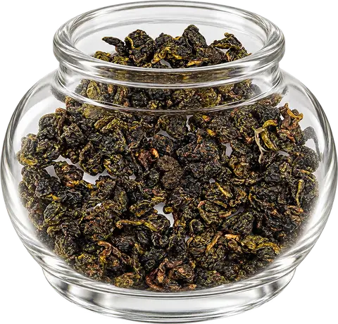 Green Vitality rolled oolong in a round glass display jar