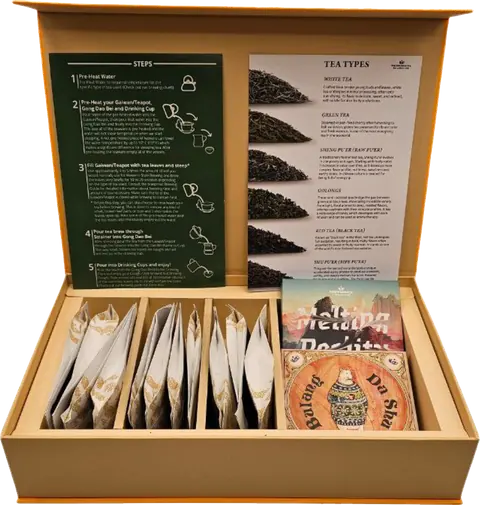 Open pu-erh tasting box with tea packets and brewing guide