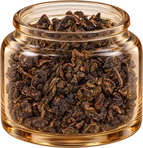 Roasted Tie Guan Yin leaves in an amber glass display jar